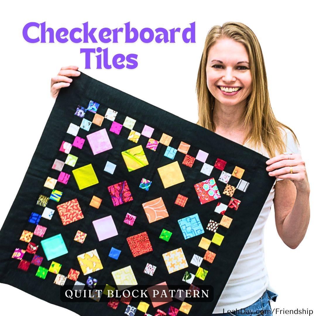 Leah Day holding a quilt block with a checkerboard tile pattern