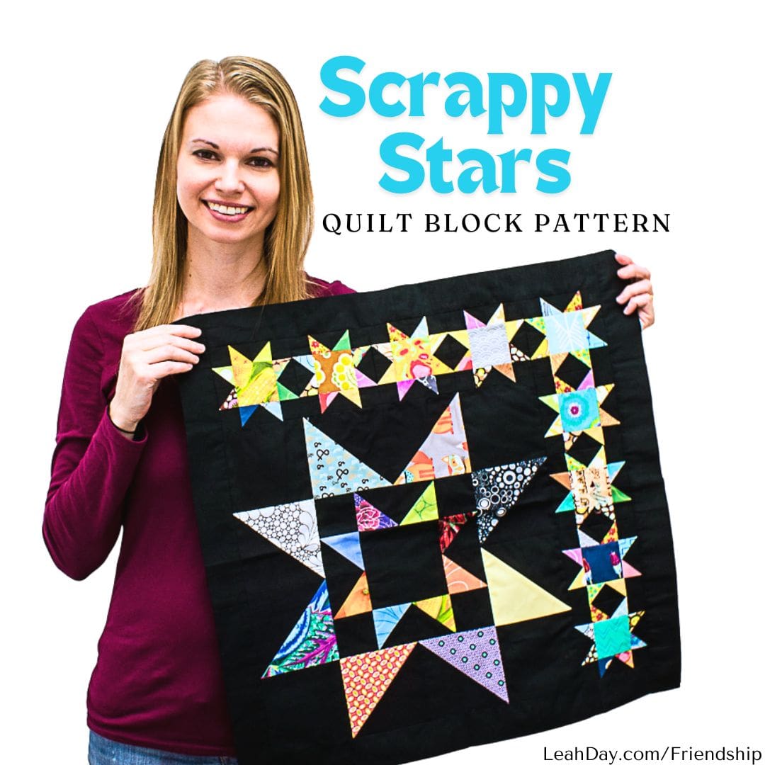 Leah Day holding a Scrappy Stars Friendship Sampler quilt block with colorful stars on a black background