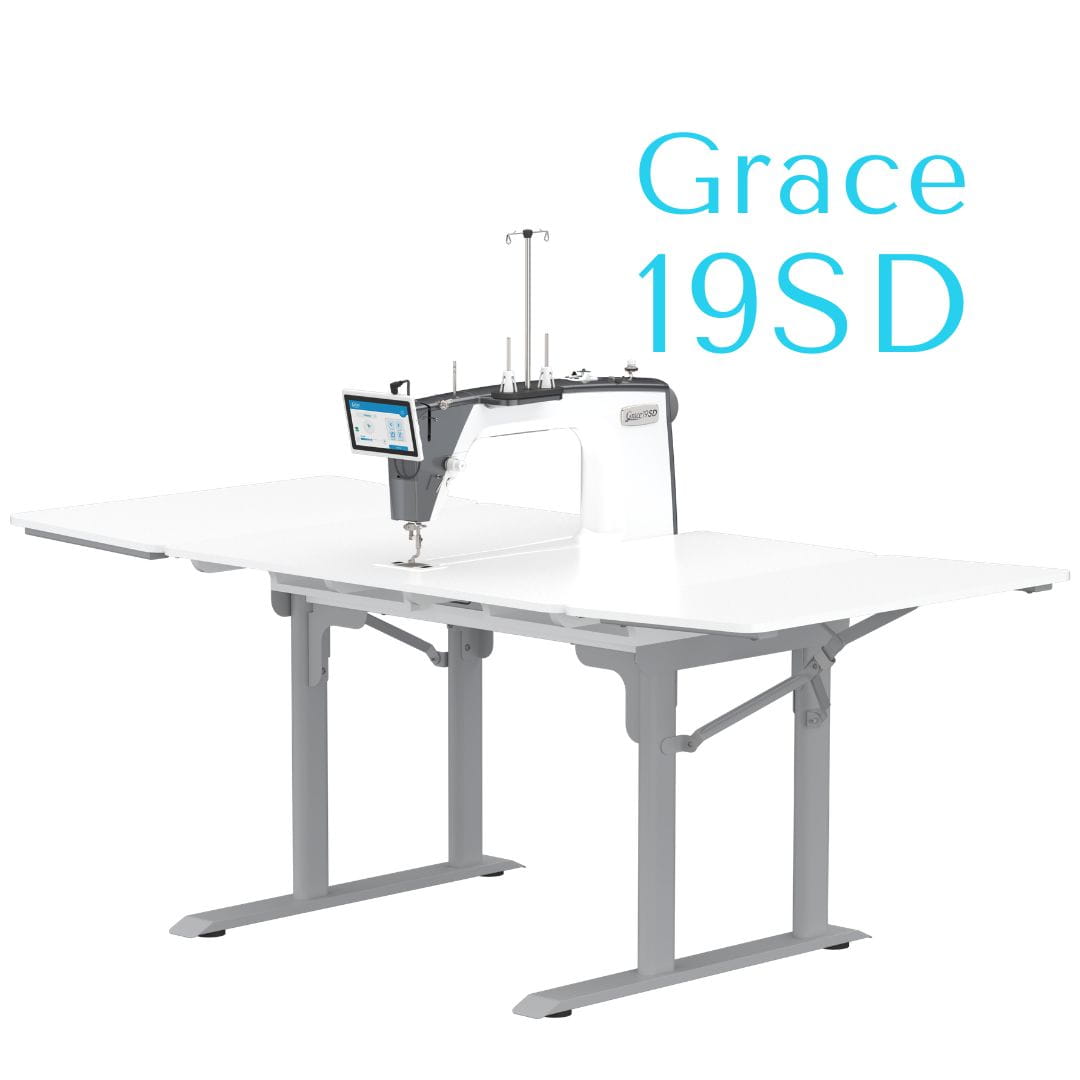 Grace 19SD sit down longarm machine in a white table