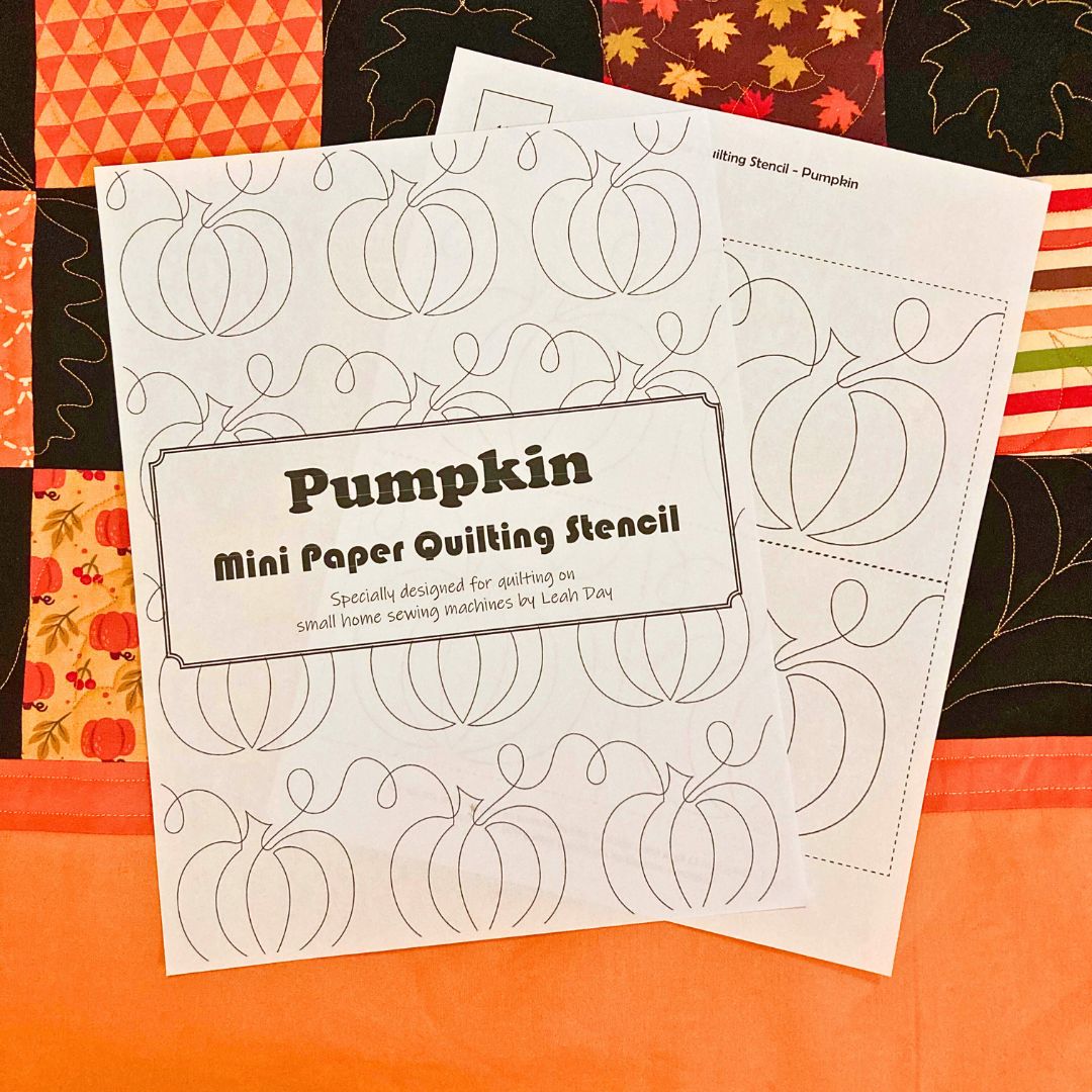 Pumpkin mini paper quilting stencil on a autumn quilt background