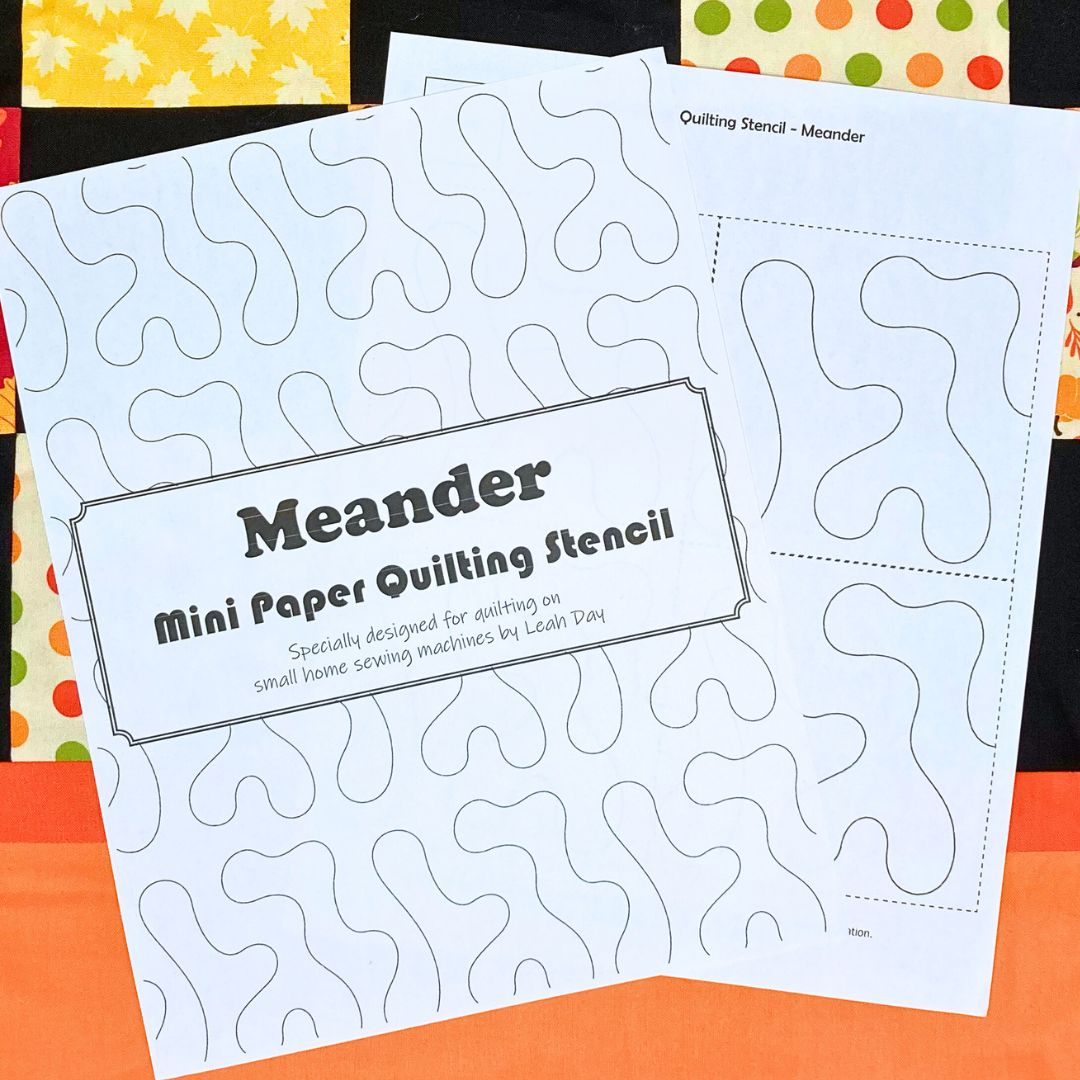 Quilting stencil with 'Meander' design on a fall quilt background