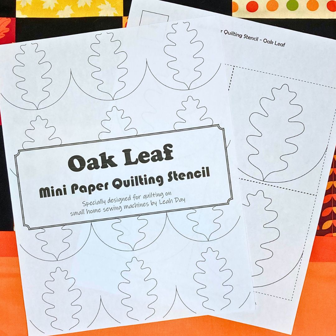 Oak leaf mini paper quilting stencil on a fall quilt background