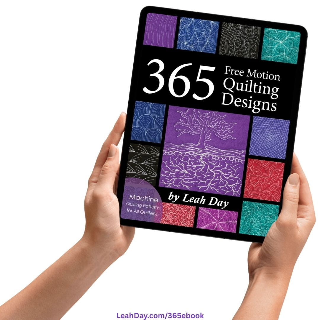 365 Free Motion Quilting Designs quilting ebook on a computer tablet