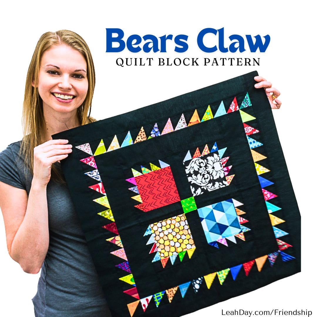Leah Day holding a colorful Bears Claw quilt block from the Friendship Sampler Quilt Along