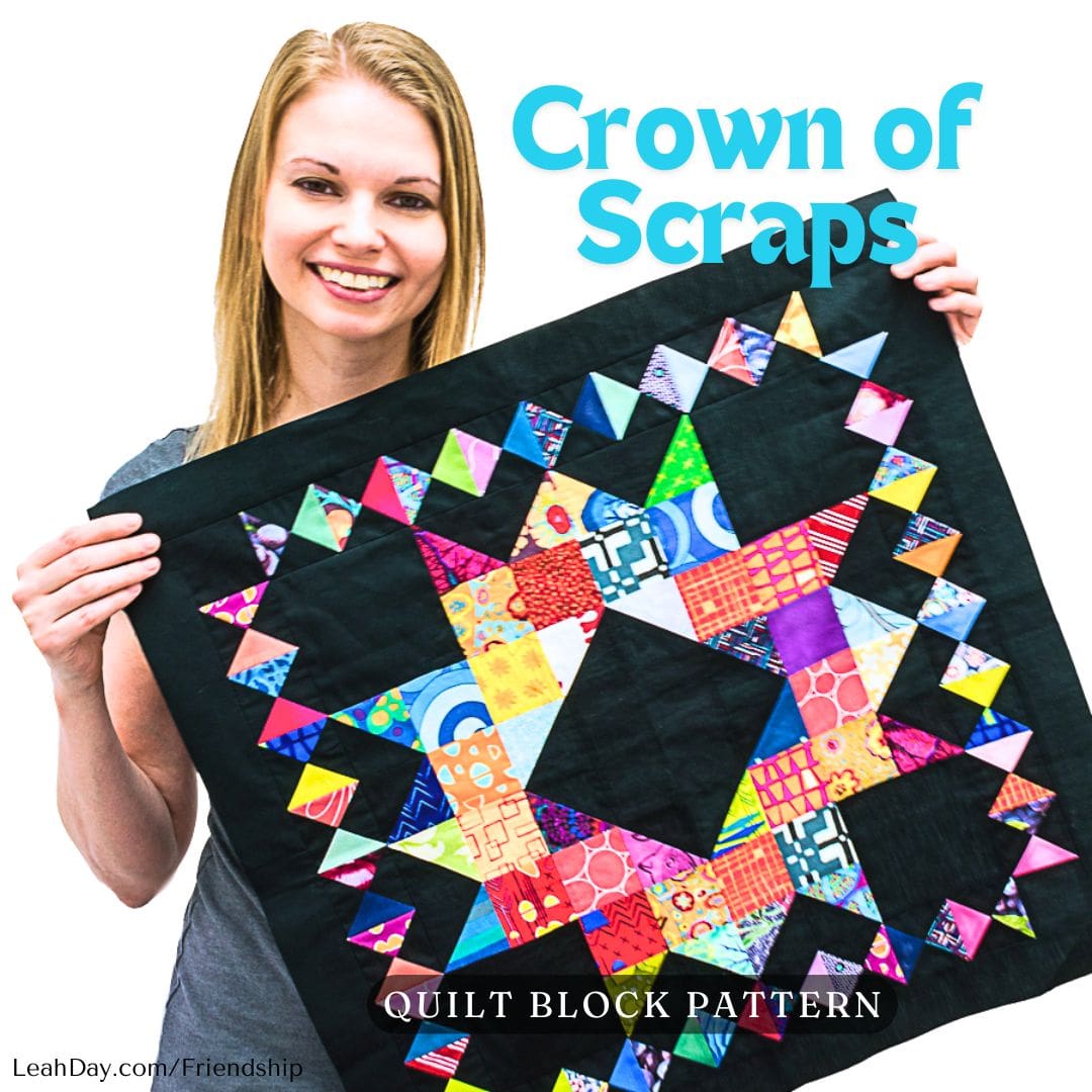 Leah Day holding a colorful Crown of Scraps quilt block from the Friendship Sampler Quilt Along