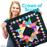 Leah Day holding a colorful Crown of Scraps quilt block from the Friendship Sampler Quilt Along