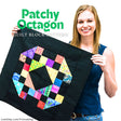 Leah Day holding a Patchy Octagon quilt block from the Friendship Sampler Quilt Along