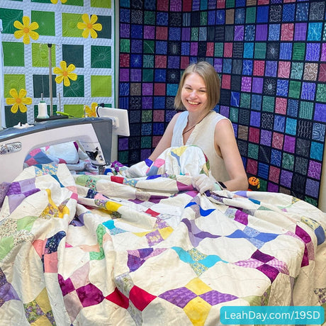 Grace 19SD with Leah Day and king sized quilt on the table