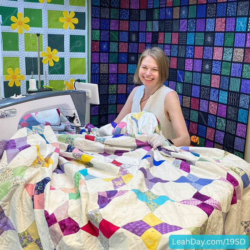 Grace 19SD with Leah Day and king sized quilt on the table