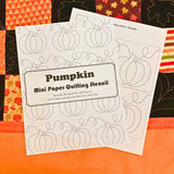 Pumpkin mini paper quilting stencil on a autumn quilt background