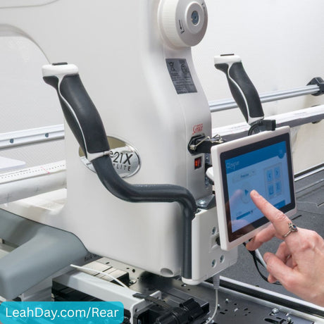 Quilter using rear handlebars on a  21X Elite longarm machine