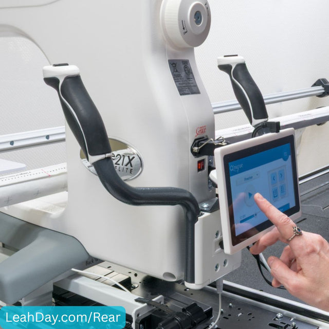 Quilter using rear handlebars on a  21X Elite longarm machine