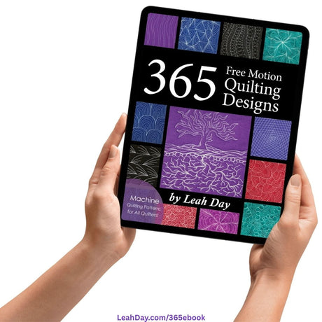 365 Free Motion Quilting Designs quilting ebook on a computer tablet