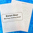 Swirl Star mini paper quilting stencil on a blue background